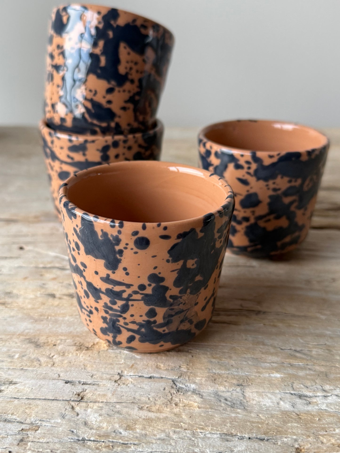 Pale terracotta & navy splatterware beaker