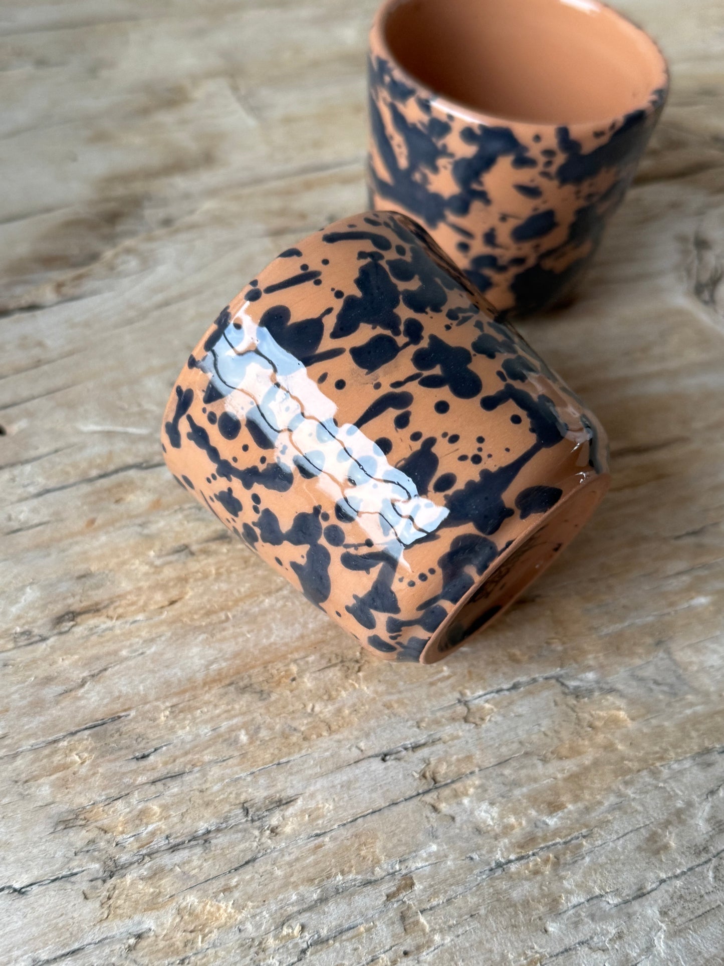 Pale terracotta & navy splatterware beaker